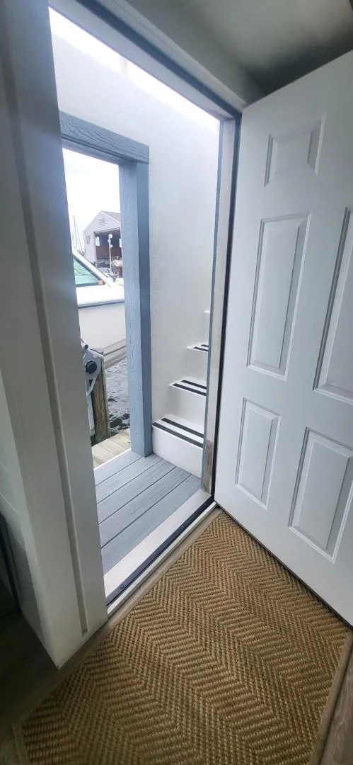 Slide: The Image of Open door view from 2020 Destination Yachts 16x45 Condo Series, showing exterior steps. - 20