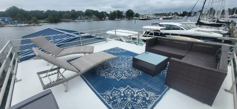 Slide: The Image of Rooftop deck of 2020 Destination Yachts 16x45 Condo Series with lounge chairs and sofa. - 24