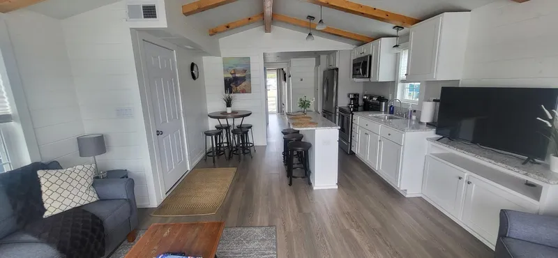 Slide: The Image of Modern interior of 2020 Destination Yachts 16x45 Condo Series with open kitchen and living area. - 7