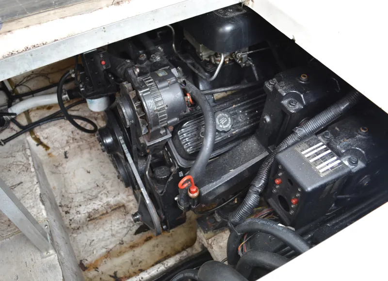 Slide: The Image of Engine compartment of a 1998 Monterey 296 Cruiser boat, showing detailed mechanical components. - 13