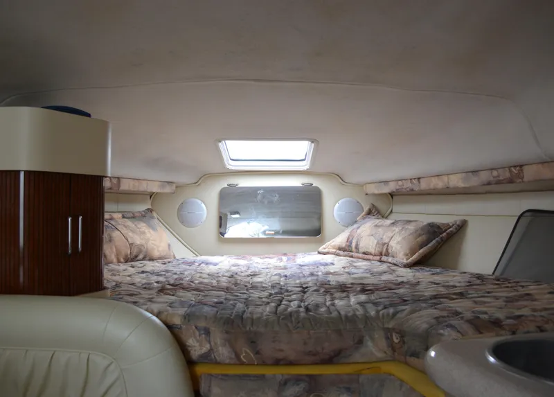 Slide: The Image of Interior cabin of 1998 Monterey 296 Cruiser with bed and skylight. - 9