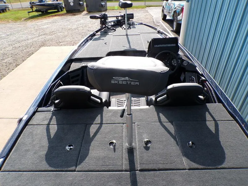 Slide: The Image of 2025 Skeeter ZXR20 fishing boat interior with Humminbird electronics and cushioned seating. - 11