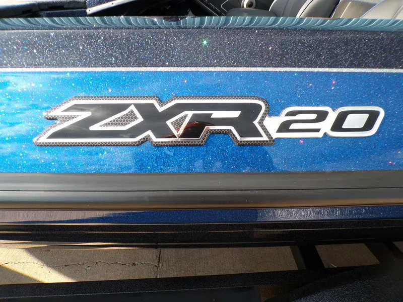 Slide: The Image of 2025 Skeeter ZXR20 boat logo on a sparkling blue surface. - 12