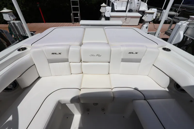 Slide: The Image of 2009 Sea Ray 270 Select EX boat interior with white upholstery. - 12
