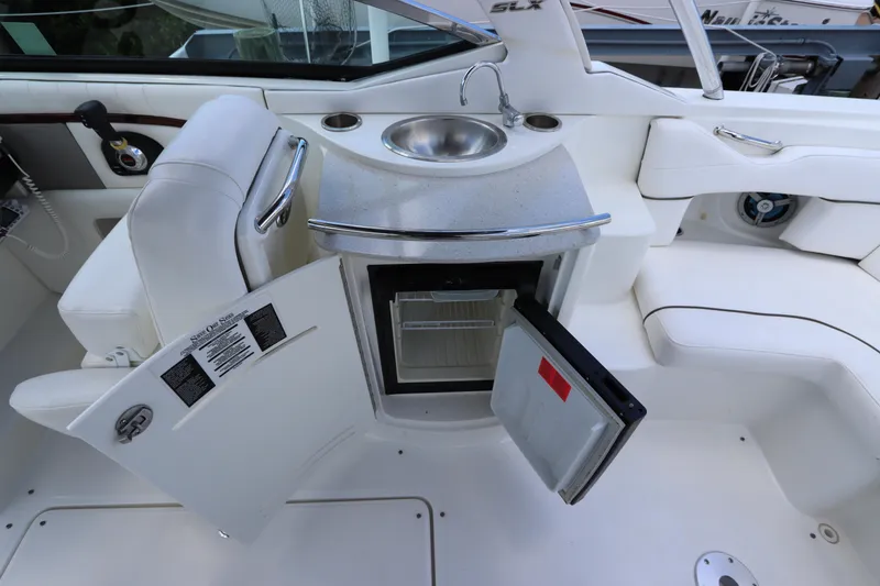 Slide: The Image of Interior of 2009 Sea Ray 270 Select EX with sink and fridge. - 16