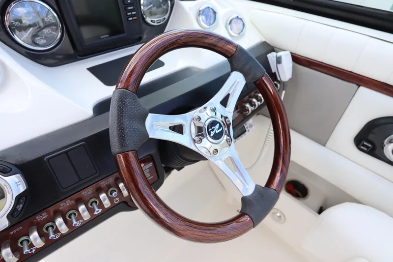 Slide: The Image of Steering wheel of a 2009 Sea Ray 270 Select EX boat. - 25