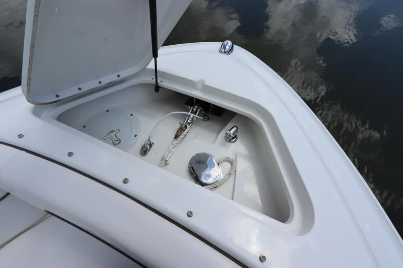 Slide: The Image of 2009 Sea Ray 270 Select EX anchor compartment with anchor and rope. - 35