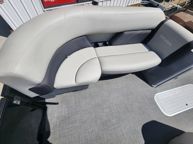 Slide: The Image of 2024 Sylvan Mirage X3 boat seating with gray and white upholstery. - 21