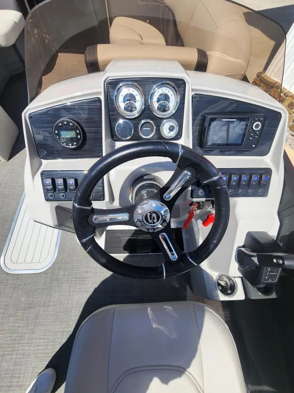 Slide: The Image of 2024 Sylvan Mirage X3 dashboard with steering wheel, gauges, and controls. - 9
