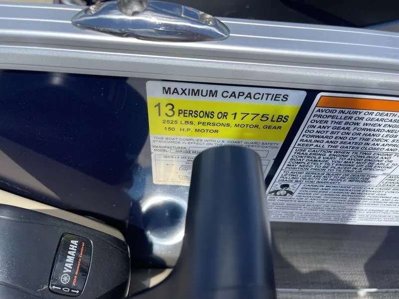 Slide: The Image of 2024 Sylvan Mirage 8524 LZ capacity label, 13 persons or 1775 lbs, 150 HP motor. - 18