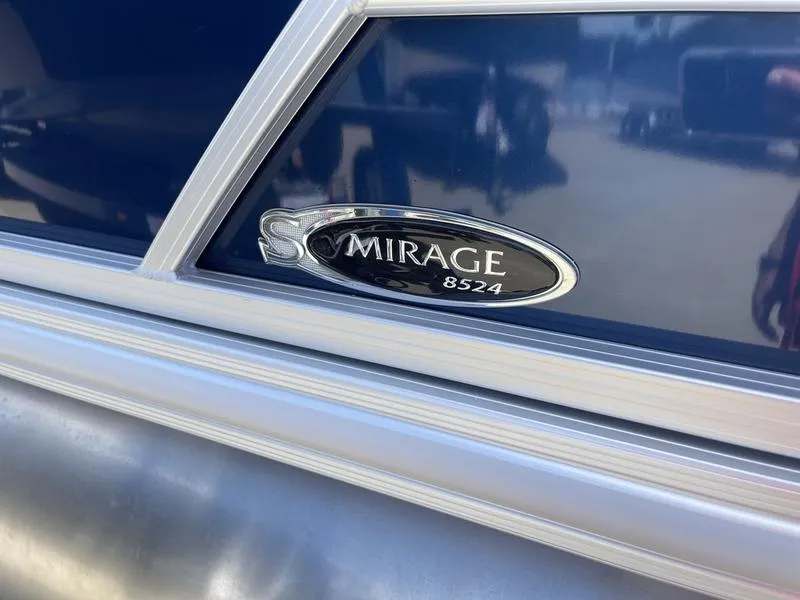 Slide: The Image of 2024 Sylvan Mirage 8524 LZ boat emblem on blue background. - 7