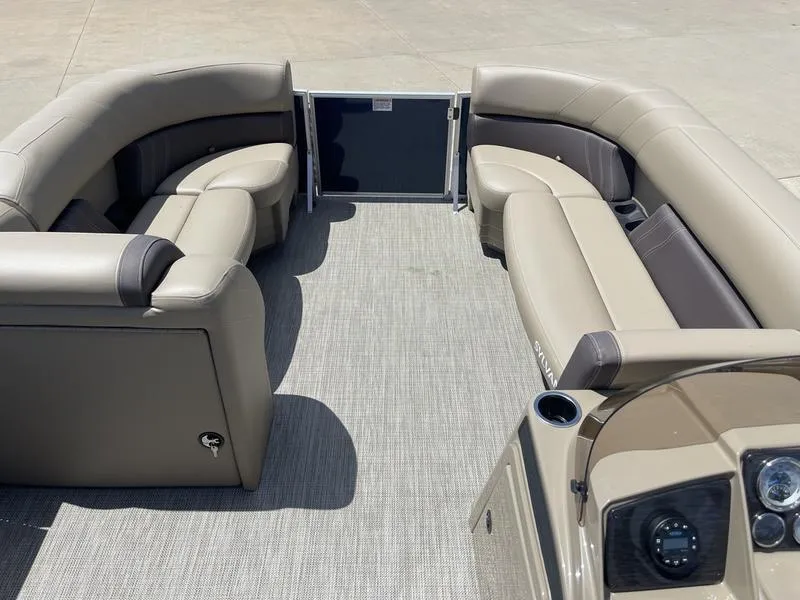 Slide: The Image of 2024 Sylvan Mirage 8524 LZ pontoon boat interior with beige seating and modern design. - 9