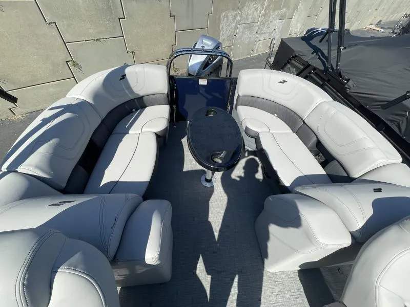 Slide: The Image of 2024 Starcraft SLS-3 boat interior with plush seating and central table. - 10