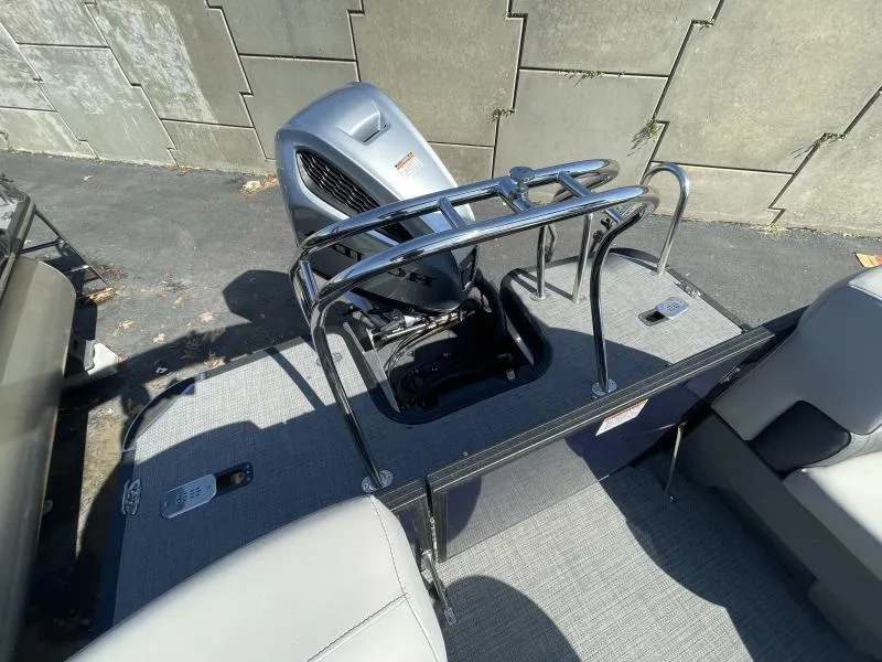 Slide: The Image of 2024 Starcraft SLS-3 boat with outboard motor and seating area. - 11