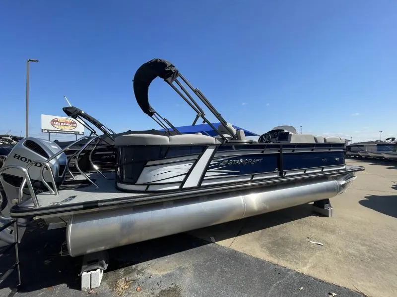 Slide: The Image of 2024 Starcraft SLS-3 pontoon boat with Honda motor, displayed outdoors under clear blue sky. - 3