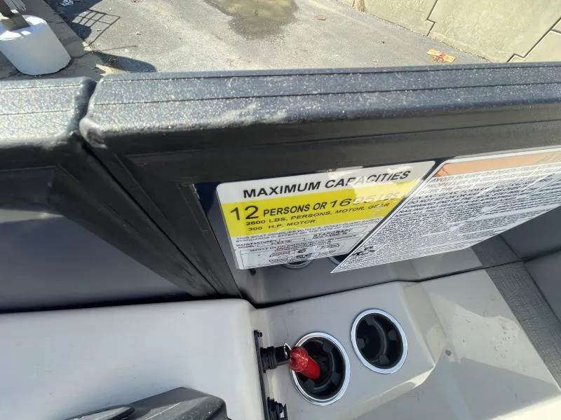 Slide: The Image of 2024 Starcraft SLS-3 boat capacity label, maximum 12 persons or 1685 lbs. - 8