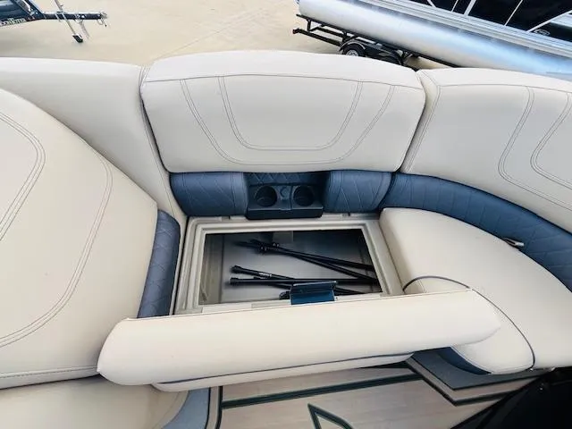 Slide: The Image of 2024 Starcraft SLS-3 boat seating with storage compartment and cup holders. - 11