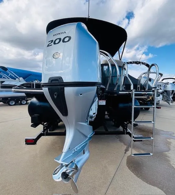 Slide: The Image of 2024 Starcraft SLS-3 boat with Honda 200 outboard motor, docked under a cloudy sky. - 5