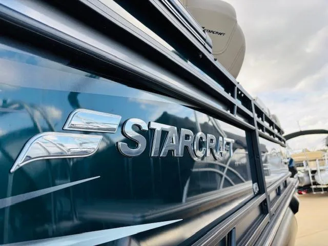 Slide: The Image of 2024 Starcraft SLS-3 boat, close-up of logo and sleek design. - 7