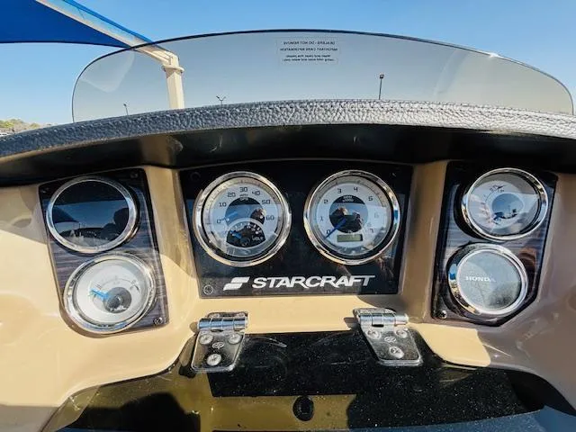 Slide: The Image of Dashboard of 2024 Starcraft SLS-3 boat with gauges and controls. - 13