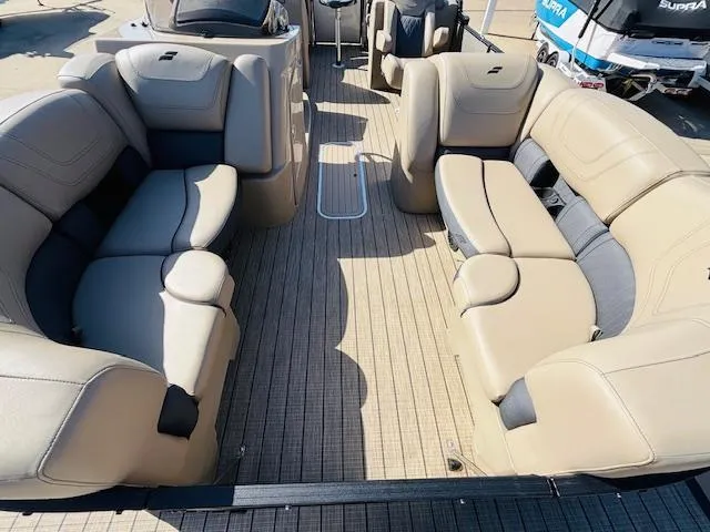Slide: The Image of 2024 Starcraft SLS-3 boat interior with beige seating and spacious layout. - 6