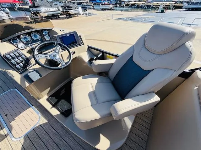 Slide: The Image of 2024 Starcraft SLS-3 boat cockpit with modern steering and comfortable seating. - 9