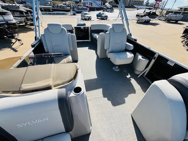Slide: The Image of 2024 Sylvan Mirage 8522 LZ pontoon boat interior with plush seating and modern design. - 20
