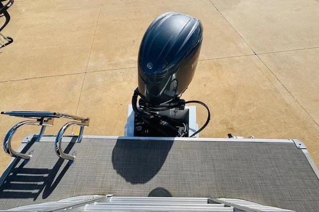 Slide: The Image of 2024 Sylvan Mirage 8522 LZ pontoon boat with outboard motor and swim ladder. - 21