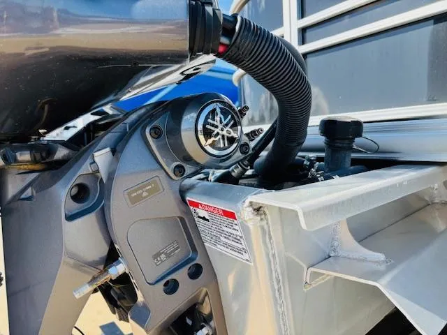 Slide: The Image of 2024 Sylvan Mirage 8522 LZ boat engine close-up, showcasing mechanical details and components. - 24