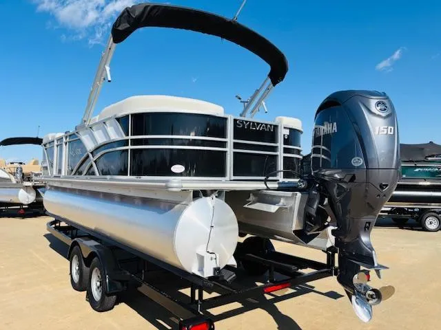 Slide: The Image of 2024 Sylvan Mirage 8522 LZ pontoon boat with Yamaha 150 engine on trailer. - 5