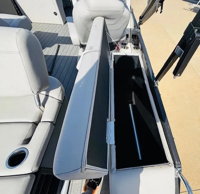 Slide: The Image of 2023 Starcraft SLS-5 Q DH boat interior with open storage compartment and seating. - 16