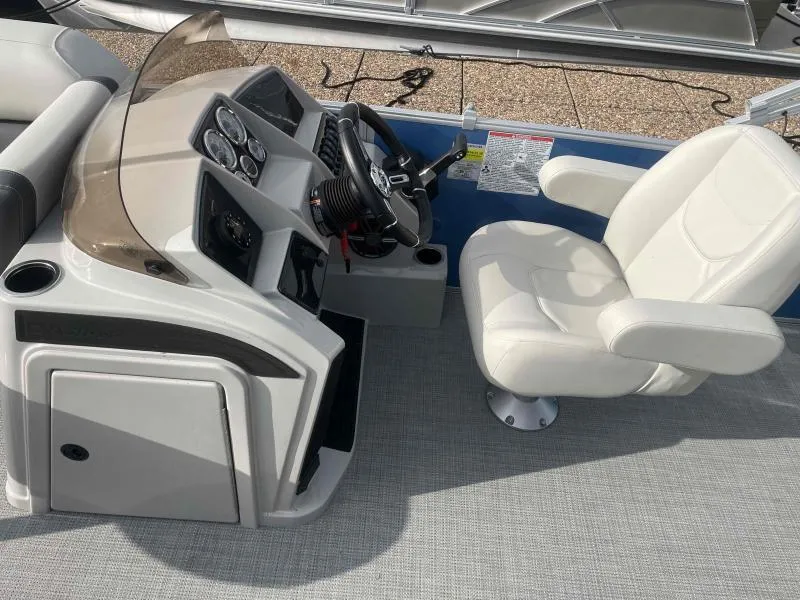 Slide: The Image of 2024 Sylvan MIRAGE 822 CLZ DH boat helm with white captain's chair and control panel. - 12