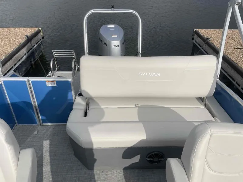 Slide: The Image of 2024 Sylvan MIRAGE 822 CLZ DH pontoon boat interior with seating and Honda motor. - 19