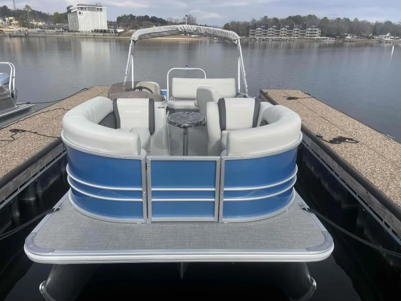 Slide: The Image of 2024 Sylvan MIRAGE 822 CLZ DH pontoon boat docked on a calm lake. - 4