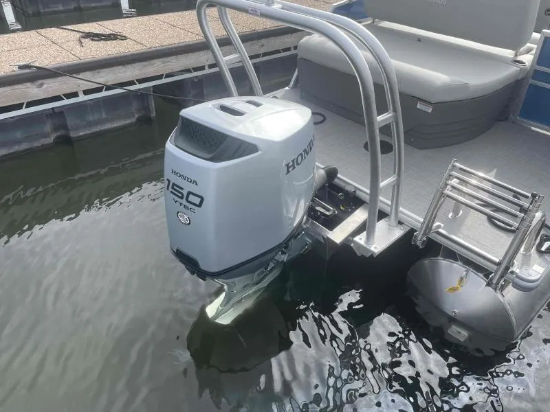 Slide: The Image of 2024 Sylvan MIRAGE 822 CLZ DH with Honda 150 VTEC outboard motor at dock. - 6