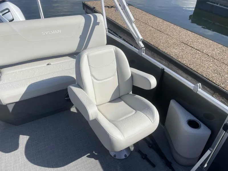 Slide: The Image of 2024 Sylvan MIRAGE 822 CLZ DH boat interior with comfortable seating and cup holder. - 12