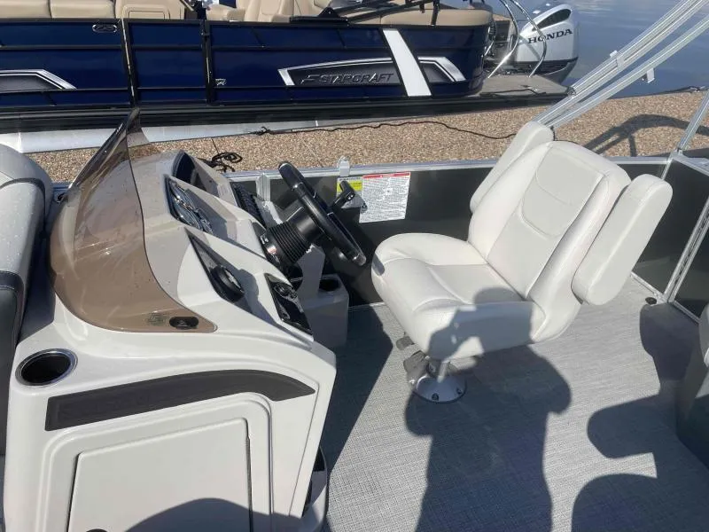 Slide: The Image of 2024 Sylvan MIRAGE 822 CLZ DH boat interior with steering console and captain's chair. - 13