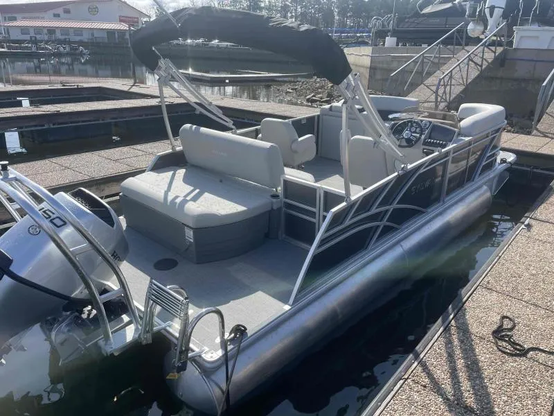 Slide: The Image of 2024 Sylvan MIRAGE 822 CLZ DH pontoon boat docked, featuring spacious seating and modern design. - 4