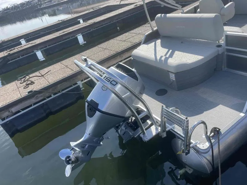 Slide: The Image of 2024 Sylvan MIRAGE 822 CLZ DH pontoon boat with 150 HP outboard motor at dock. - 5