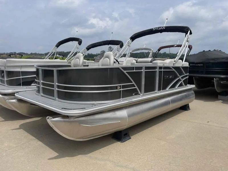Slide: The Image of 2024 Sylvan Mirage 818 Fish pontoon boat displayed outdoors. - 1