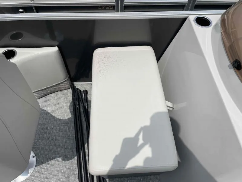 Slide: The Image of 2024 Sylvan Mirage 818 Fish boat interior with white seating and cup holders. - 9