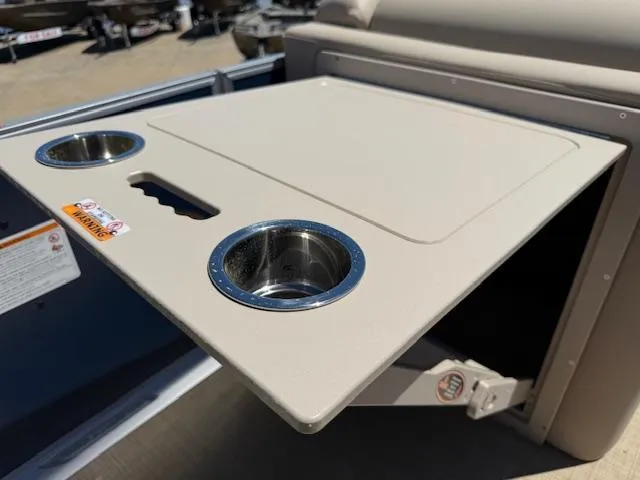 Slide: The Image of 2024 Harris Boats HCX 25 Cruiser 250 table with cup holders, beige finish. - 18