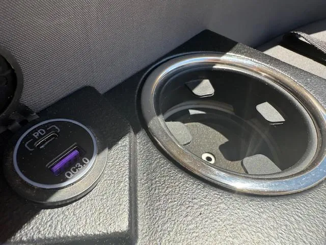 Slide: The Image of Cup holder and USB port on 2024 Harris Boats HCX 25 Cruiser 250. - 23