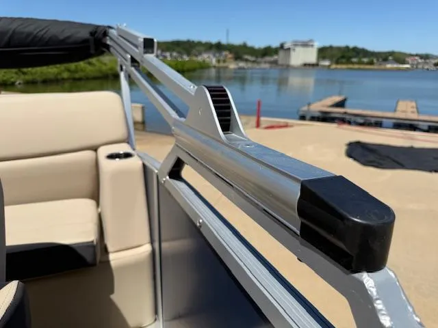 Slide: The Image of 2024 Harris Boats HCX 25 Cruiser 250 interior detail with lake view in the background. - 25