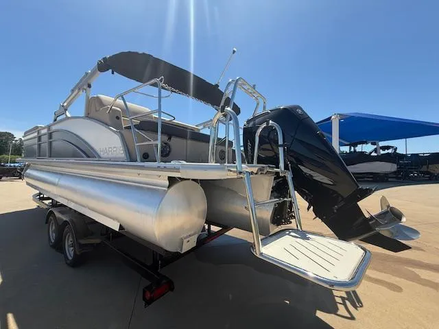 Slide: The Image of 2024 Harris Boats HCX 25 Cruiser 250 pontoon with outboard motor and trailer. - 5