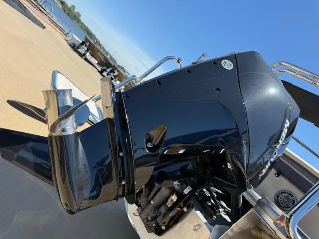 Slide: The Image of 2024 Harris HCX 25 Cruiser 250 boat with a powerful Mercury outboard motor. - 7