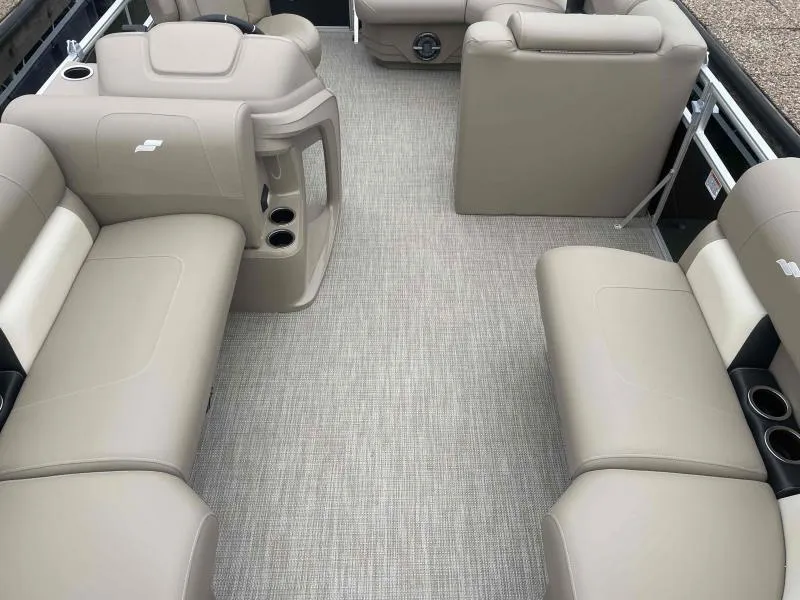 Slide: The Image of 2024 Starcraft LX 20 CB boat interior with beige seating and carpeted flooring. - 7