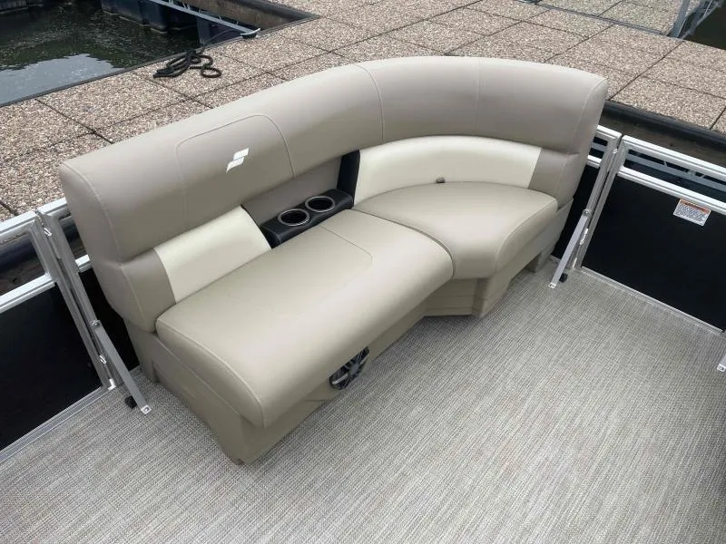 Slide: The Image of 2024 Starcraft LX 20 CB boat seating with beige upholstery and cup holders. - 8