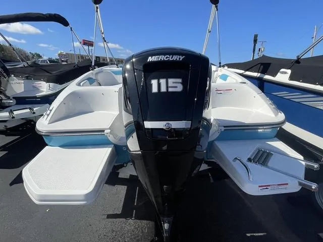 Slide: The Image of 2023 Bayliner E18 boat with Mercury 115 engine, displayed outdoors. - 3