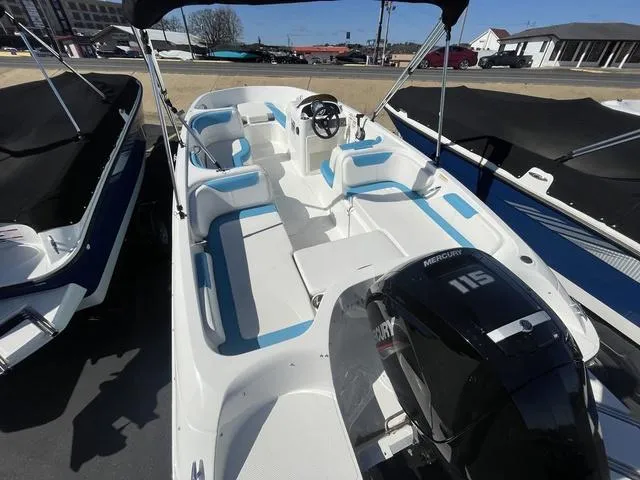 Slide: The Image of 2023 Bayliner E18 boat with Mercury 115 engine, featuring spacious seating and sleek design. - 4